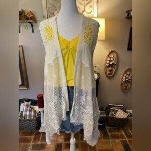 Shyanne knit & crochet high low t-back cream colored vest.